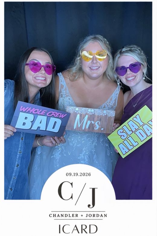 Chandler & Jordan wedding print: the bride with friends holding 'Whole Crew Bad' and 'Slay All Day' signs